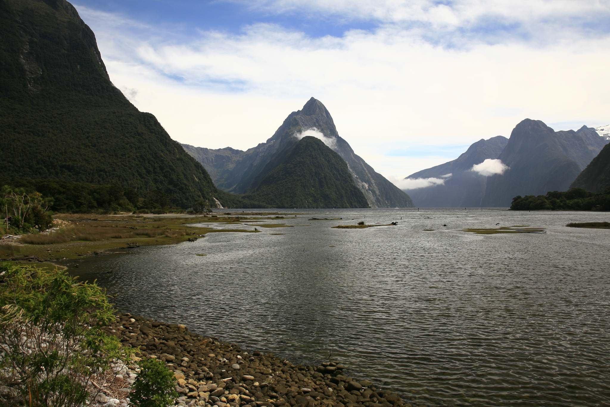 Overland Travel through the South Island of New Zealand will bring you to the shores of the most beautiful body of water you have ever seen - Milford Sound ...  photo by CC user vendin on Flickr 
